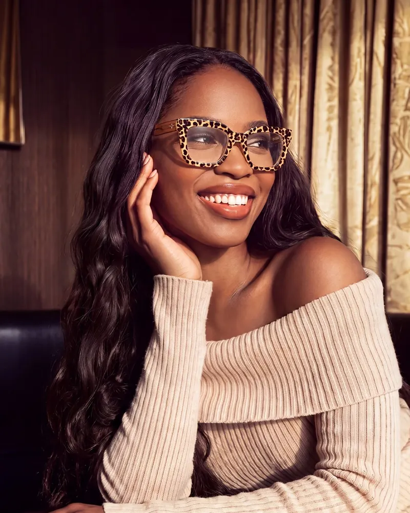 Woman wearing eyeglasses with long dark hair